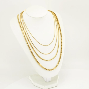 Golden stainless steel wheat chain necklaces in four different thicknesses on a neck model