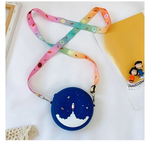 Detail of blue silicone rocket bag with a colorful rainbow gradient donut print strap