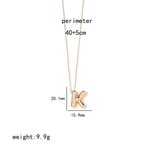 Detail of gold letter K pendant necklace with 40+5cm chain length and size specs