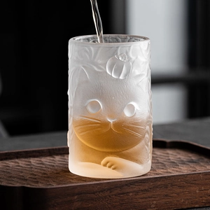 Frosted glass tea cup with embossed cute cat design and minimalist cylindrical shape