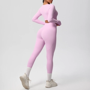 Pink yoga set detail showing side pocket on high-waist leggings and brushed fabric