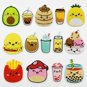 Detail view of 14 assorted food embroidery patches showing fine stitching and vibrant colors