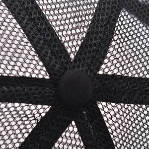 Macro detail of breathable mesh interior and reinforced seams on the black outdoor cap