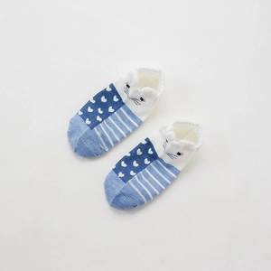 Detail of blue and white striped cotton socks with a cute 3D animal face and heart pattern
