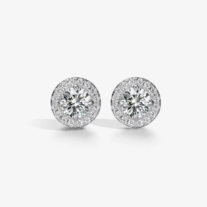Close-up of S925 silver halo stud earrings featuring round cubic zirconia in a claw setting