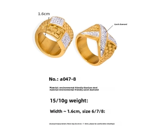 Detailed view of gold plated titanium rings with woven texture and diamond accents