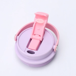 Detail of pink and purple tumbler lids featuring flip-top design and sturdy carry handles