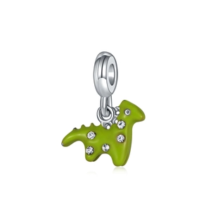 Macro shot of green enamel dinosaur charm with white cubic zirconia and silver clasp