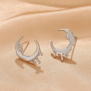 Macro view of silver crescent moon earrings with unique melting drop metallic effect