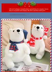 Close-up of plush Christmas polar bears wearing festive blue and red scarves and hats