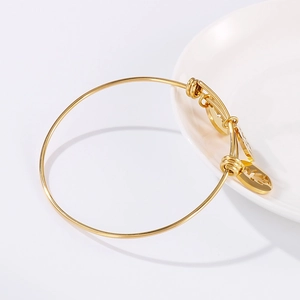 Adjustable gold titanium steel bracelet featuring hollow circle charms and love engravings