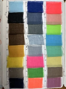 Detailed color chart of 24 gauze table runner fabric samples in various vibrant shades