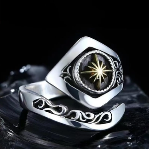 Macro shot of vintage sun god ring with gold star emblem and gothic relief details