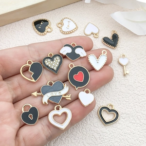 Mixed black and white heart wing charms with gold alloy frame for DIY jewelry making