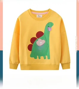 Detail of yellow cotton sweatshirt featuring green dinosaur applique and floral pocket