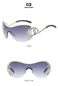 Close-up of Y2K rimless sunglasses featuring silver snake-shaped temples and purple lenses