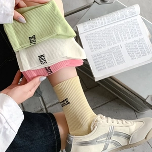 Pastel ribbed cotton crew socks with LUCK letter embroidery in multiple colors