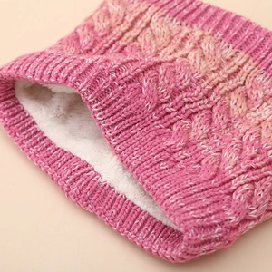 Detail of pink gradient cable knit texture and warm white faux fleece lining for kids