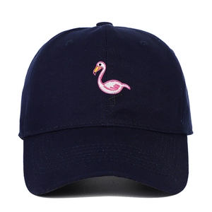 Detailed close-up of pink flamingo embroidery on navy blue cotton baseball cap crown