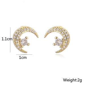 Detail view of 18K gold plated moon earrings with micro-inlaid cubic zirconia stones