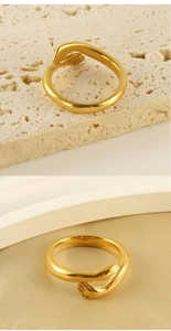 Detail of 18k gold plated hug ring featuring a creative hugging hands design for women