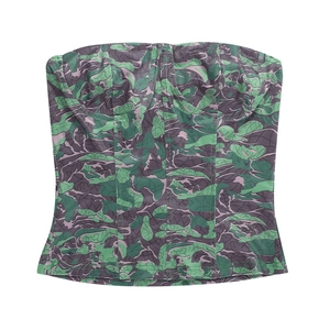 Detail of floral camo corset top showing structured boning and vibrant leaf pattern