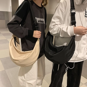 Unisex nylon crescent crossbody bag with adjustable wide strap in beige and black colors