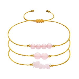 Detail of three adjustable pink quartz beaded bracelets with woven yellow cords