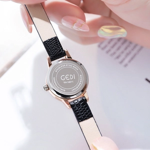 Vintage rose gold ladies quartz watch with black leather strap and stainless steel back
