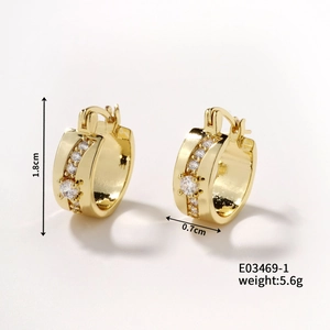 Detail view of gold earring with cubic zirconia showing 1.8cm height and 0.7cm width