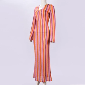 Detail of V-neck knitted maxi dress with vibrant orange and purple chevron pattern
