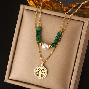 Double-layered 18K gold tree of life necklace with green beads and white pearl detail