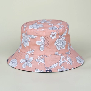 Close-up of pink bucket hat with white peony pattern and black lining detail