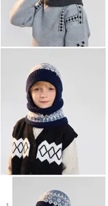 Detail of kids winter knit balaclava hat with dark blue and beige jacquard patterns