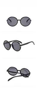 Übergroße runde Retro-Sonnenbrille in glänzendem Schwarz mit Silberdetails