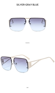 Detail view of silver metal semi-rimless sunglasses with blue gradient lenses and hollow frames