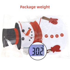 Christmas snowman felt pendant package weight measurement of 30.2g on digital scale