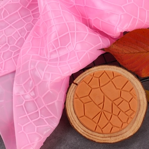 Macro detail of pink silicone mold with geometric bark texture for DIY cake baking decoration