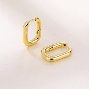 Minimalist U-shaped geometric earrings in gold plated brass with elegant oval lines