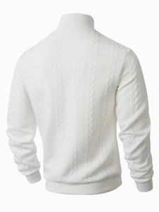 Detailed back view of white cable knit sweater showing textured 3D weave and ribbed cuffs