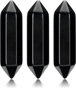 Three polished black obsidian double terminated hexagonal crystal points on white background