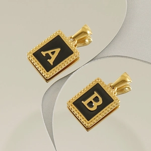 Golden stainless steel rectangular letter pendants A and B with black enamel inlay