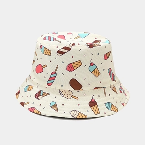 Close-up of cute cartoon ice cream print and cotton texture on beige bucket hat
