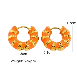 Close-up of 2cm orange enamel stripe hoop earrings in gold-plated stainless steel