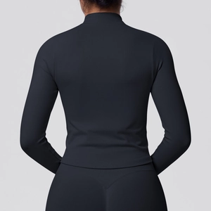 Detail of seamless black ribbed back design on high-neck zip-up athletic jacket