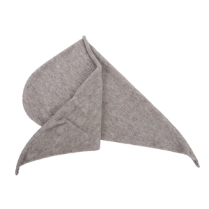 Close-up of the fine knit texture and soft grey fabric of the winter triangle scarf