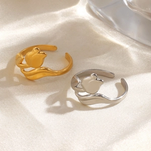 18K gold and silver stainless steel tulip flower open rings on a silk background