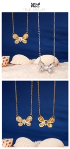 Macro detail of butterfly necklace with pavé zirconia wings and water-drop crystal inlay