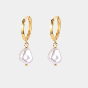 Close-up of elegant S925 silver golden hoop earrings with Baroque irregular pearls