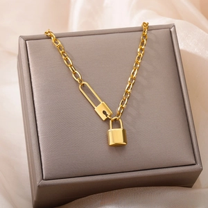 Detailed shot of 18k gold plated stainless steel lock pendant with toggle link chain